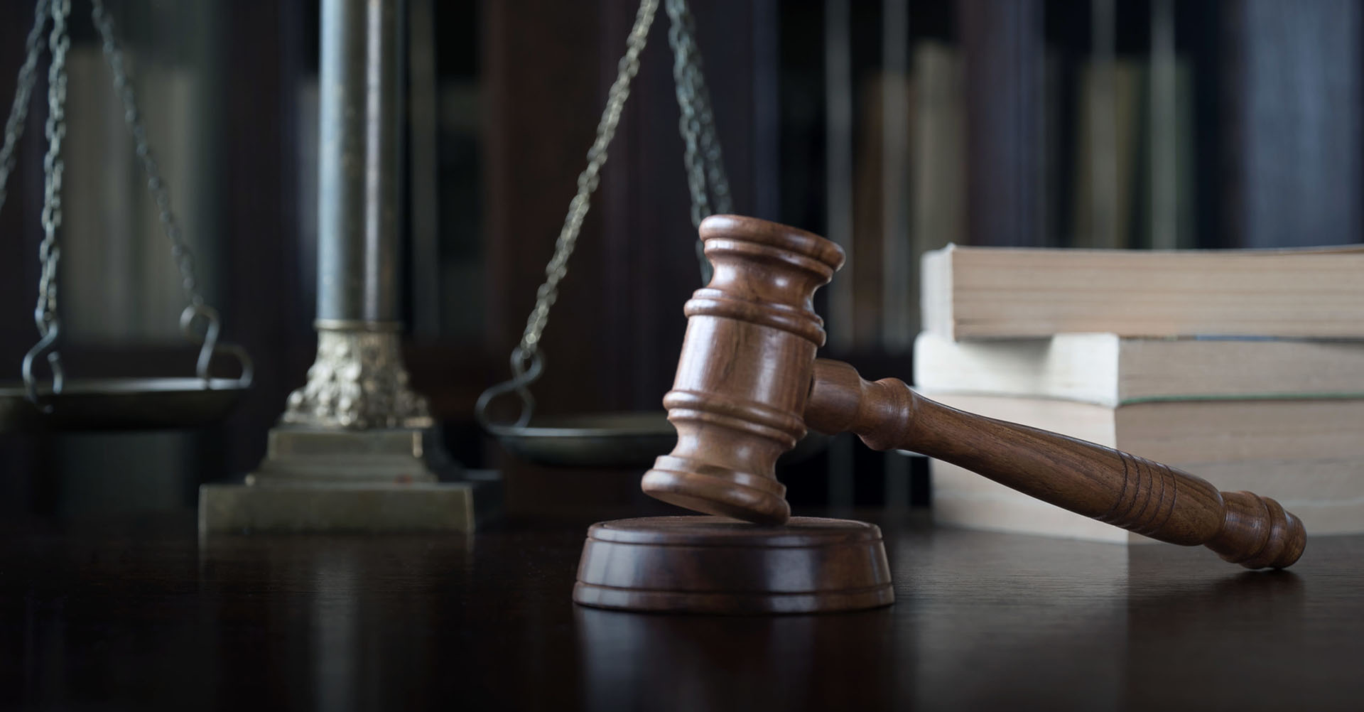 A judge's gavel and scales symbolizing the justice system